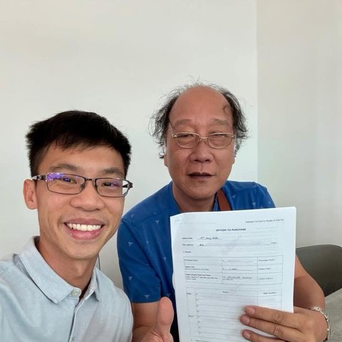 Wilfred with his client, signed option to purchase in hand